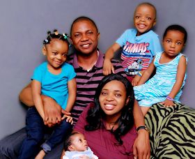 Rev Dr Obinna with his wife, Favour, and family