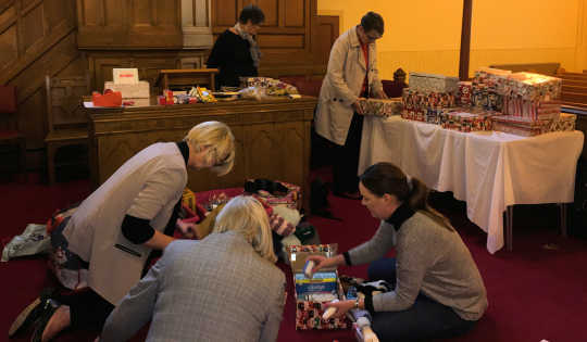 Preparing the shoeboxes for delivery to Blythswood Care