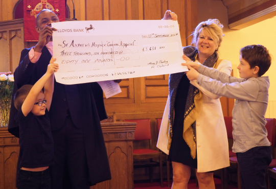 The cheque is presented to Karen McFadzean